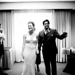 bride and groom excited as they walk down the isle photographed by Daniel Stark