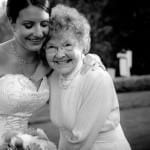 The bride hugs her grandma in a tender embrace before her wedding by Daniel Stark Photography.