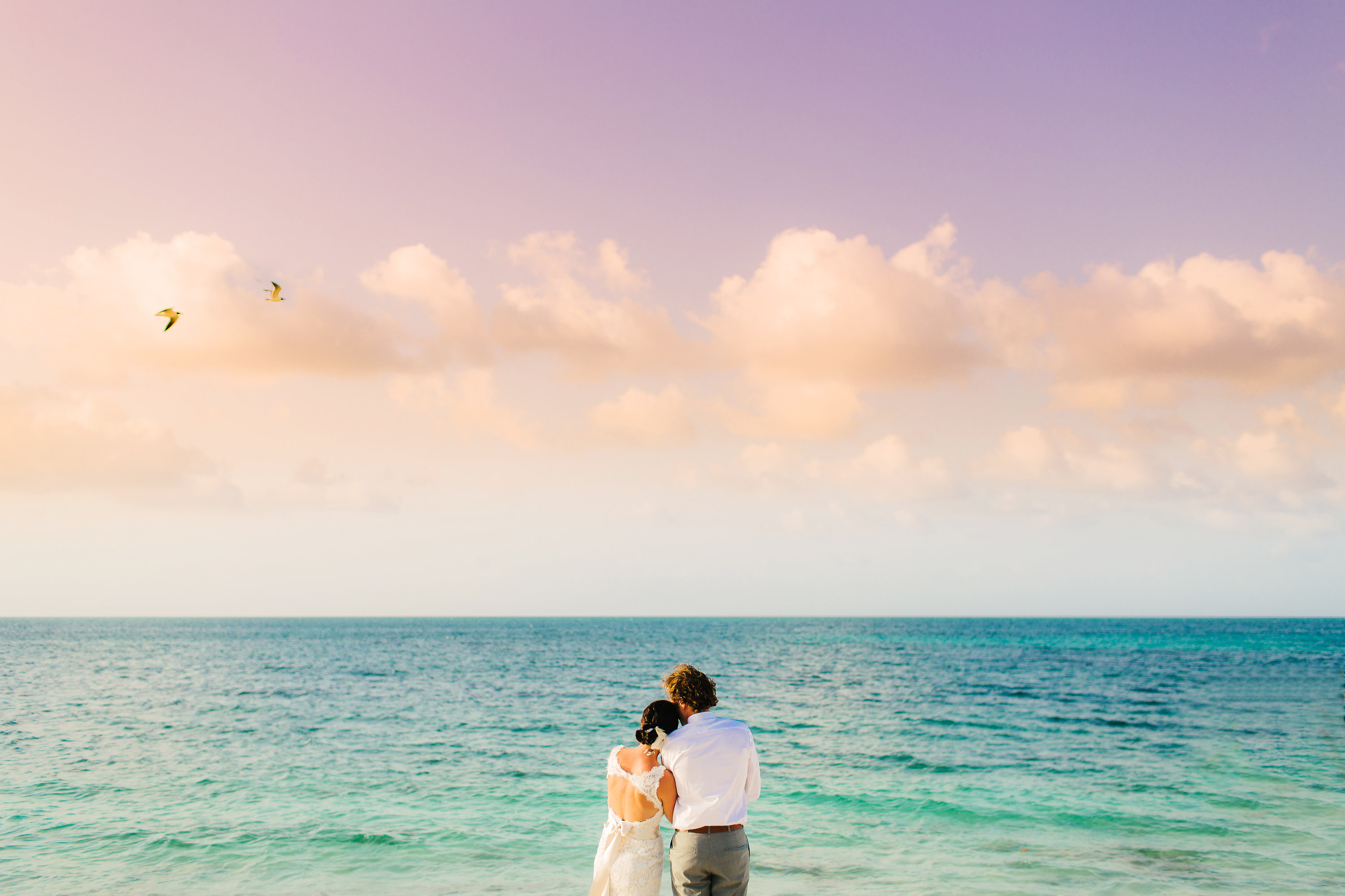 A bride and groom enjoying the sunset at Mother's House in Turks and Caicos.