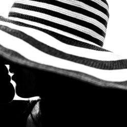 A cool black and white engagement photo of a couple kissing in Portland, Oregon.