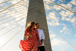 A beautiful and fun downtown Portland engagement shoot on the Tilikum Bridge with the cityscape in the background.
