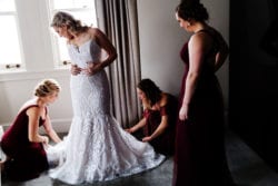 bride getting into wedding gown in The Benson Hotel