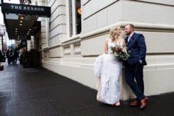 Bride & Groom in front of the Benson for their downtown Portland wedding
