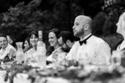 Groomsmen listening to a toast at Camp Angelos wedding photographed by Stark Photography