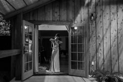 bride getting into her dress at camp Colton cabins