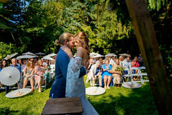 couple embrace after first kiss at wedding