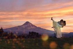 couple dip for a portrait in front of mt. hood