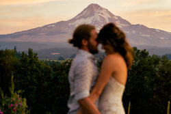 Portrait of a wedding couple with Mt. Hood in focus