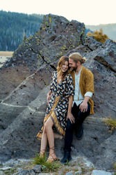 Bride and Groom posing on a rock in Central Oregon