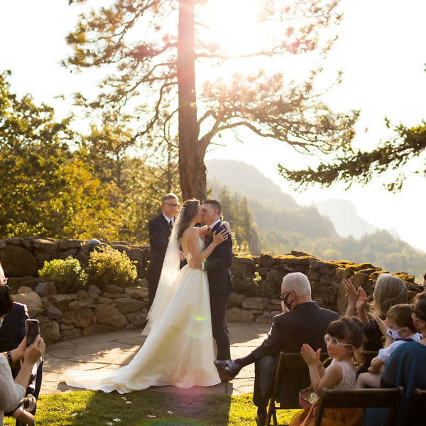 First kiss during a Griffin House wedding with a view of the gorge.