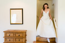 bride coming down steps before wedding
