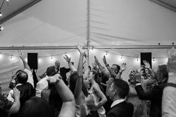 Wedding guests dance and throw their hands up for the DJ at a wedding at The Griffin House in Hood River, Oregon.