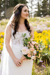 bride posing in wildflowers on mt. hood