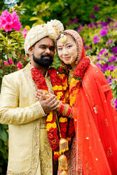 portrait of an Indian groom and Mien bride after their wedding ceremony