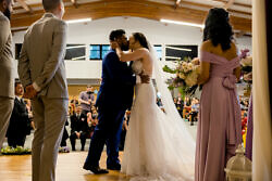 bride and groom first kiss inside a Portland church