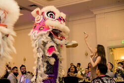white lotus dragon dancers perform at a wedding in downtown portland