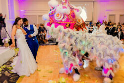 white lotus dragon dancers perform at a wedding in downtown portland