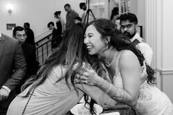 bride hugging a guest during traditional mien tea ceremony at a Portland wedding