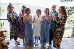 bride toasting champagne with her bridesmaids overlooking Columbia gorge
