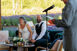 wedding couple laughing to a wedding speech