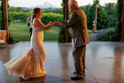 father dancing with daughter in wedding reception at the orchard hood river